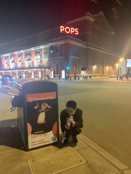 Me next to a trash can with a picture of Keith Lockhart