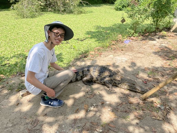 Me petting a crocodile